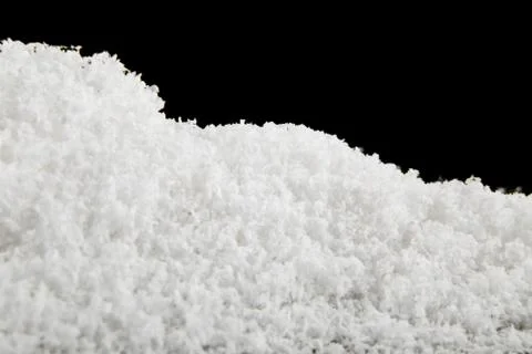 Snow on a black background close-up Stock Photos