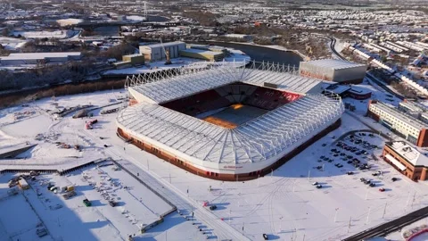 Snow blankets the ground around Sunderland Stadium of Light after January winter Stock Footage 325792002