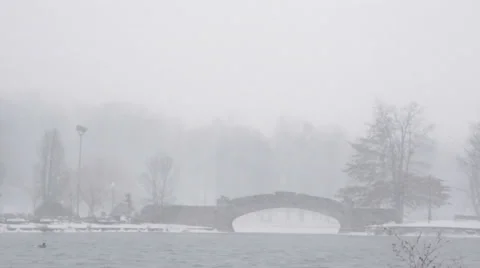 Snow Blizzard - Bridge over lake Stock Footage 34301251