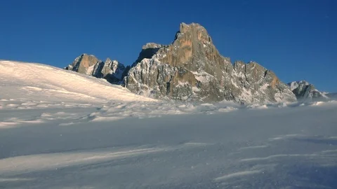 Snow blizzard in the mountain with the view of Cimon della Pala Stock Footage 127703430