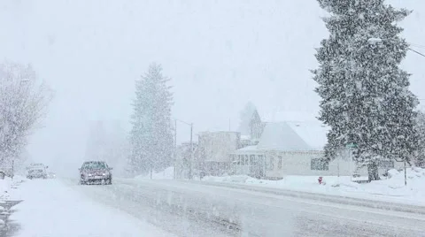 Snow blizzard small town traffic HD Stock Footage 1090884