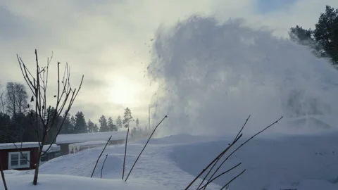 Snow blower in action during a winter morning, creating a high spray of sno.. Stock Footage 287073508