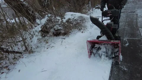 Snow blower in action to plow ice on the street, filmed at 4K 60 fps Stock Footage 147635925