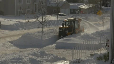 Snow Blower Clearing Sidewalk in a City Suburb. Stock Footage 84328778
