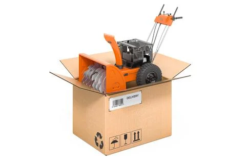Snow blower machine inside cardboard box, delivery concept. 3D rendering Stock Illustration