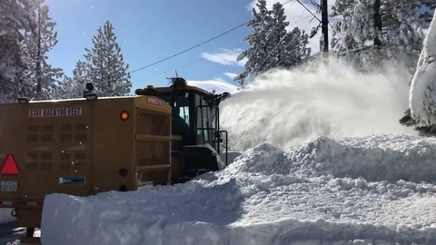 Snow blower removing snow Stock Footage