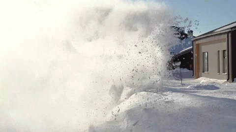 Snow blower throws snow Stock-Footage 148131299
