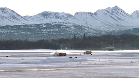 Snow Blowers and Grader Working to Keep Runway Clear Stock Footage 10754626