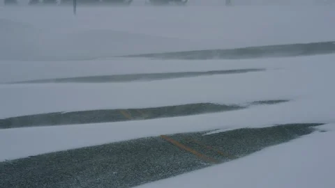 Snow Blowing Across Empty Road Stock Footage 313385355
