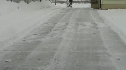 Snow blowing driveway Stock Footage 18171923