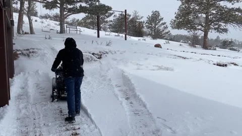 Snow blowing driveway Stock Footage 242976978
