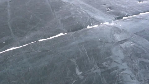 Snow blowing over thick ice 1 Stock Footage 240905325