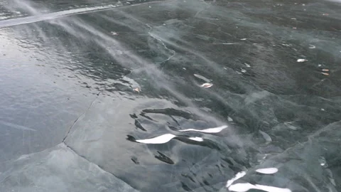 Snow blowing over thick ice 6 in slow motion Stock Footage 240928867