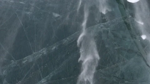 Snow blowing over thick ice 5 Stock Footage 240928969