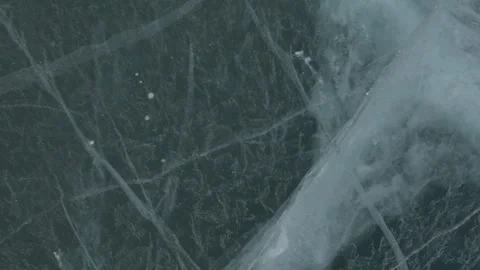 Snow blowing over thick ice 4 Stock Footage 240932572