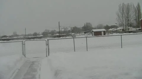 Snow blowing sidewalk Stock Footage 18172165