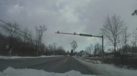 Snow blows back rural drive Stock Footage 8557644