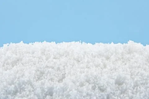 Snow on a blue background Stock Photos