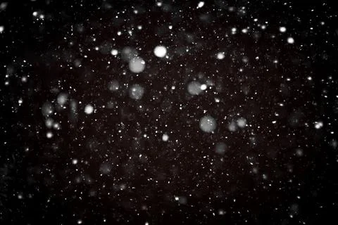 Snow bokeh texture on black background Stock Photos
