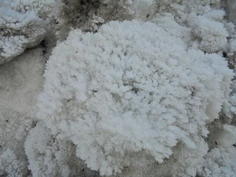 Snow boulder with ice crystal structure on the surface. Stock Photos