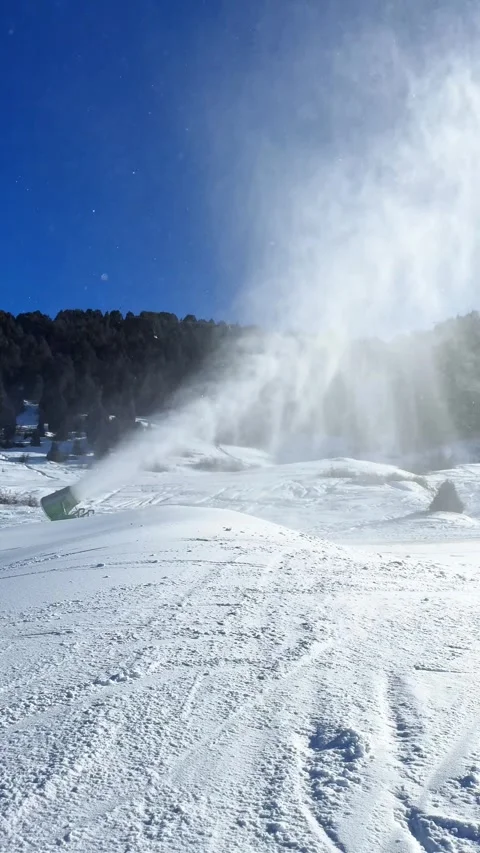 Snow cannon, fan-type snow generator works at a ski resort Stock Footage 299573373