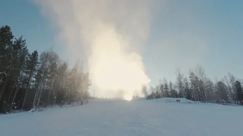 Snow cannon generates a lot of artificial snow at ski-resort in early winter. A Stock-Footage 171695877