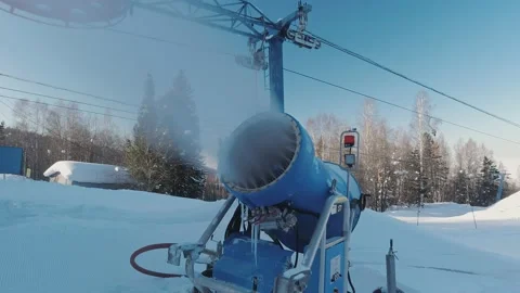 A snow cannon machine producing snow at ski-resort. Snow-making systems. Stock Footage 171695652