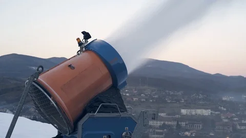 The snow cannon makes artificial snow on the slope of the mountain ski resort Vídeo Stock 97796977