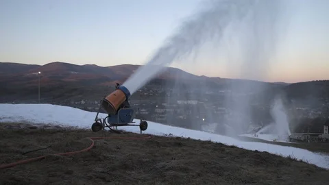 The snow cannon makes artificial snow on the slope. Winter sports Video stock 97797183