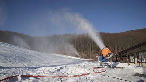 The snow cannon makes artificial snow on the slope. Winter sports 库存影片 97797230