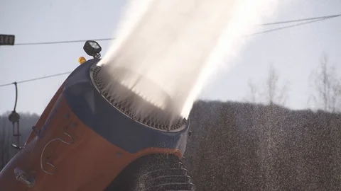 The snow cannon makes artificial snow on the slope of the mountain ski resort Stock-Footage 97797388