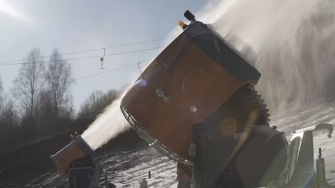 The snow cannon makes artificial snow on the slope. Winter sports 動画素材 97797392