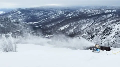 Snow cannon makes artificial snow on the ski slope in ski resort. Stock Footage 298180304