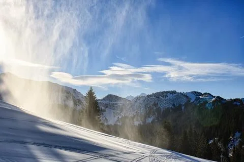 Snow Cannon Making Artificial Snow on Ski Slope in French Alps Stock Photos
