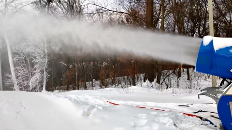 Snow cannon making artificial snowy powder near piste, mountain track. winter re Stock Footage 282108782