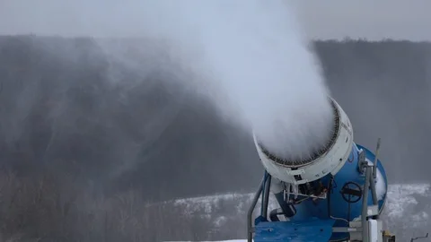 Snow cannon making snow at ski resort in slow motion Stock Footage 100441575