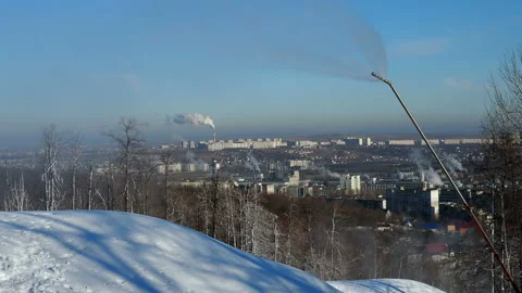 Snow cannon preparing a slope to ski in the background of the urban landscape Stock Footage 144194096