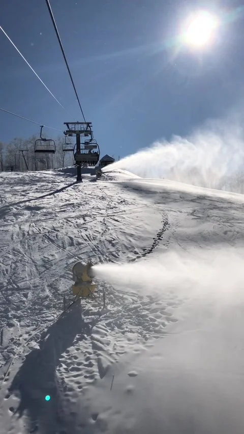 Snow cannon in the process of snowmaking on the ski slope Stock Footage 149215128