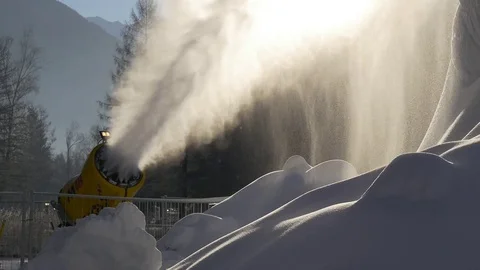 Snow cannon in the rays of the rising sun Stock Footage 71124171