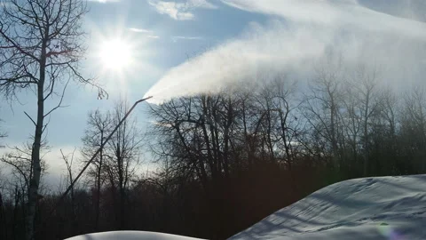 Snow cannon. Snowmaker in action at ski resort spraying artificial snow Stock Footage 143684083