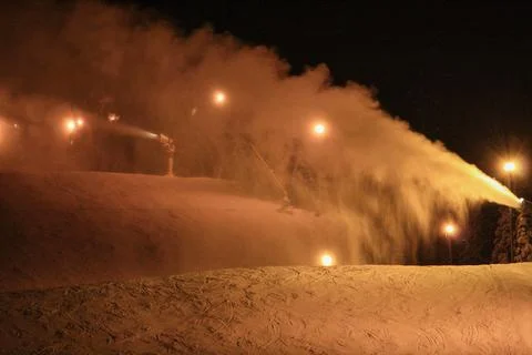 Snow Cannons Making Artificial Snow on Ski Slope at Night in Trysil Stock Photos