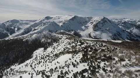 Snow capped Eastern Sierra Mountains aerial view above 10,000 feet Stock Footage 98499011