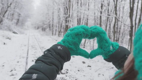The snow-capped forest creates a great atmosphere for a women's walk. The girl Stock Footage 246869301