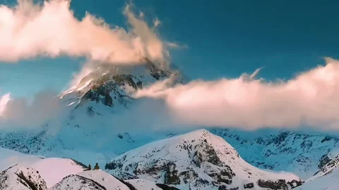 Snow-Capped Horizons: Captivating Sunset in the Mountainous Wonderland	 Stock Footage 252435463