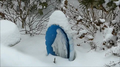 Snow capped Madonna statue Stock Footage 34744698