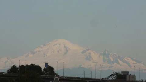 Snow Capped Mount Baker View From Canada with Busy Bridge in Foreground Stock Footage 219373715