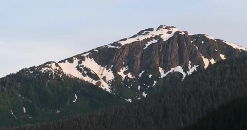 Snow capped Mount Bradley on Douglas Island at sunset, Juneau, Alaska. Stock Footage 306767910