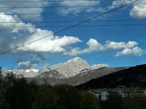 Snow Capped Mountain Peak And Local Village Near Jiuzhaigou National Park Stock Photos