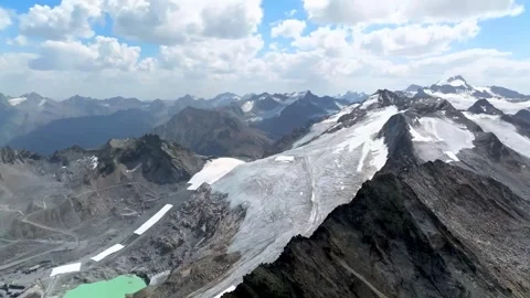 Snow capped mountain peaks and deep glacier valley from above Stock-Footage 341328330