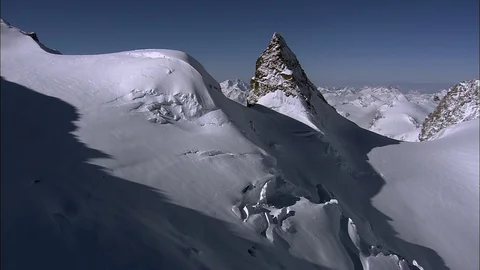 Snow-capped mountain peaks, Smooth, relaxing snowy scene in the mountains Stock Footage 108603401